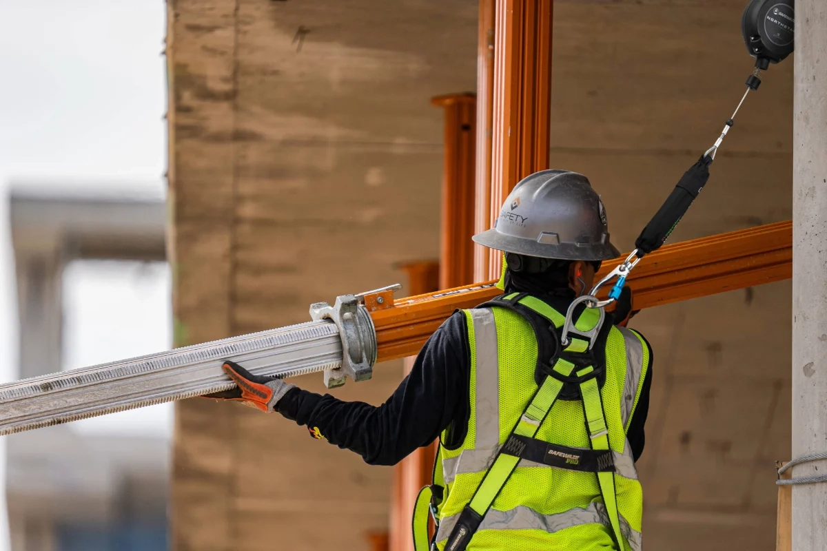 Construction worker using a SafeWaze harness and self-retracting lifeline